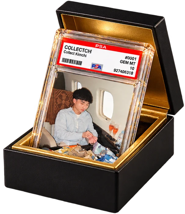 A black and gold collector box with a card inside